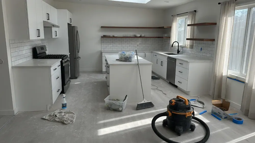 A cleaner removing fine drywall dust in a newly renovated Montgomery County home interior